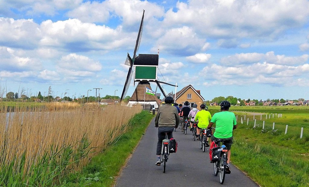 Boat and bike cycling holiday windmill Amsterdam