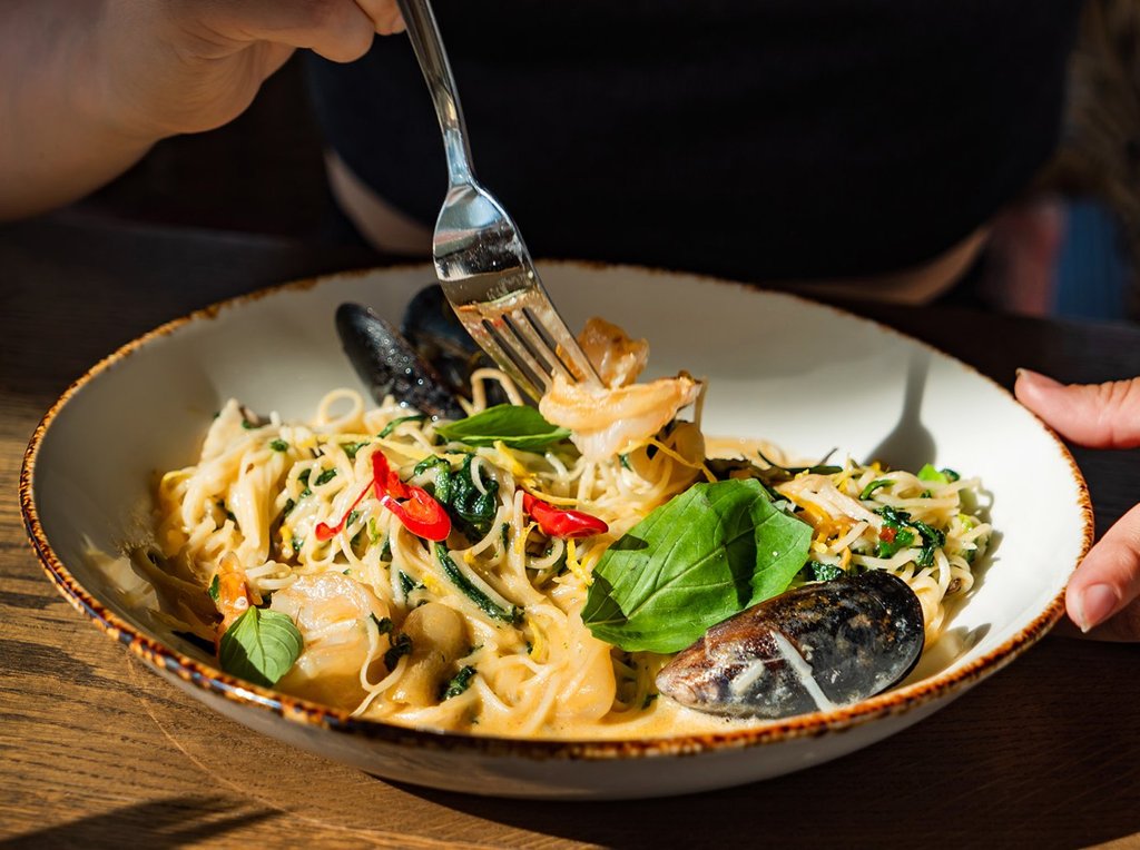 Eating spaghetti in Umbria